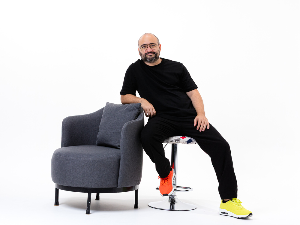 Zak Dakkash speaking with a microphone